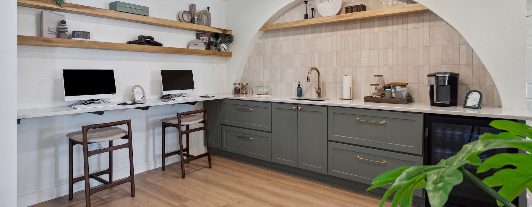 a community kitchen with a bar and island