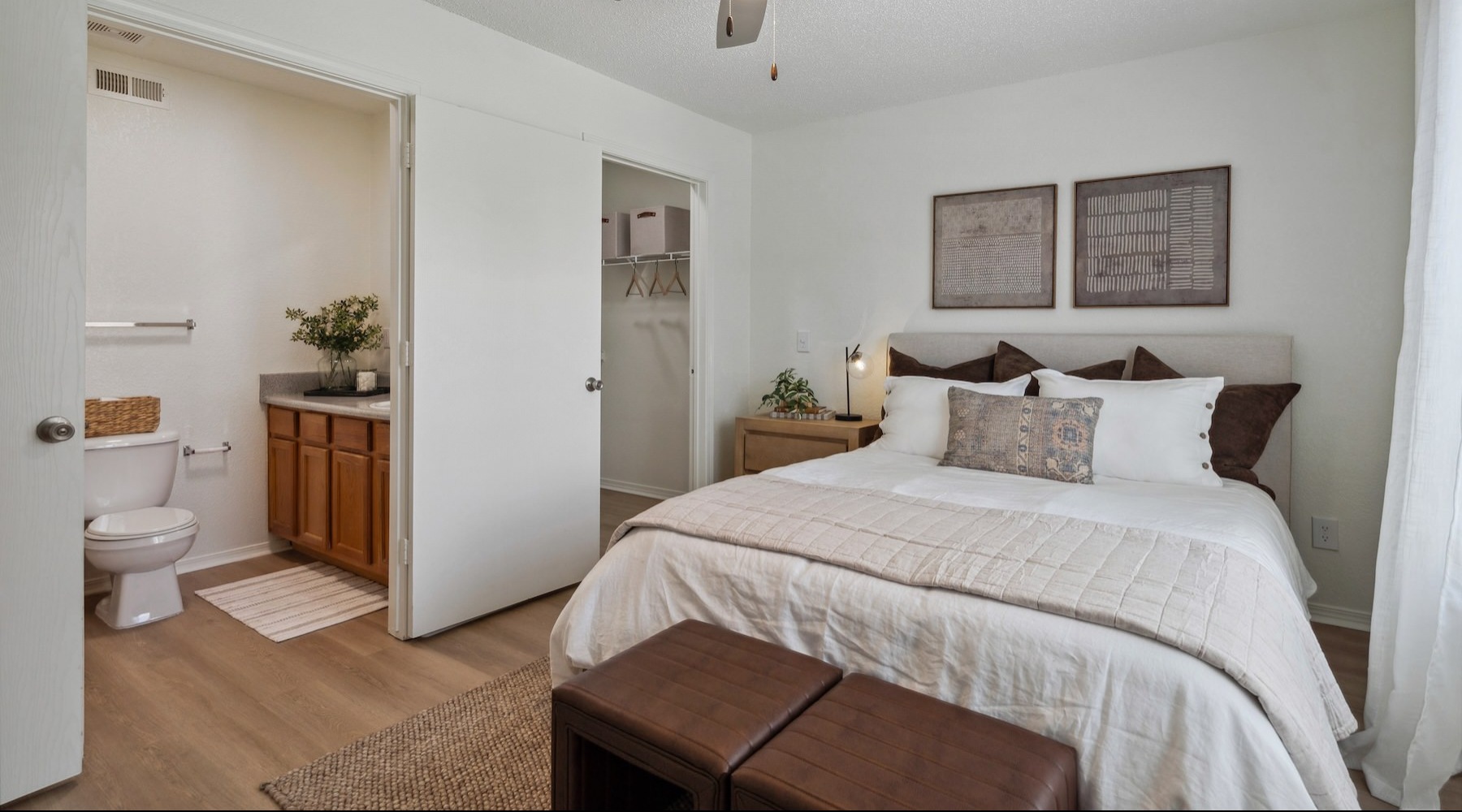 a bedroom with a bed and a bathroom