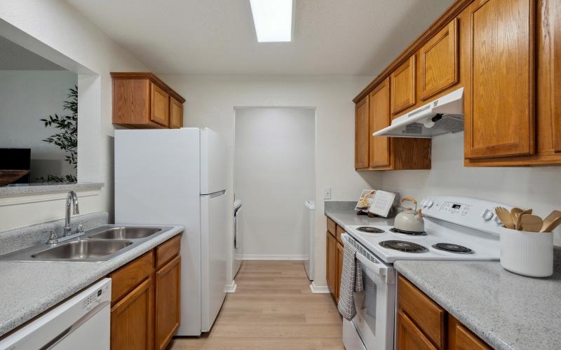 a kitchen with wooden cabinets